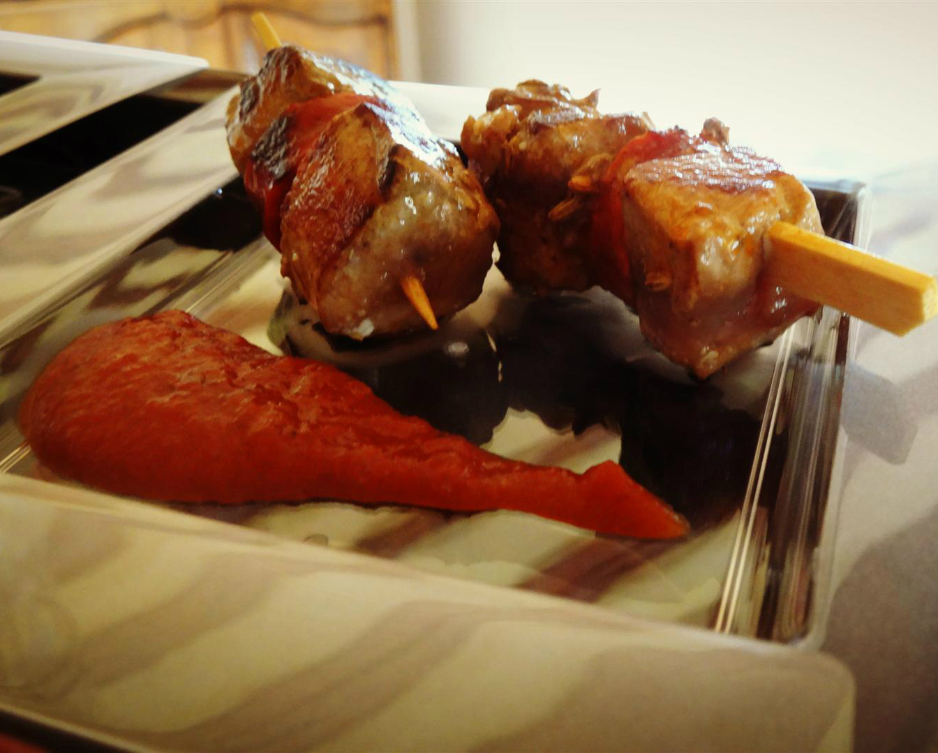 tuna and chorizo skewers on a plate